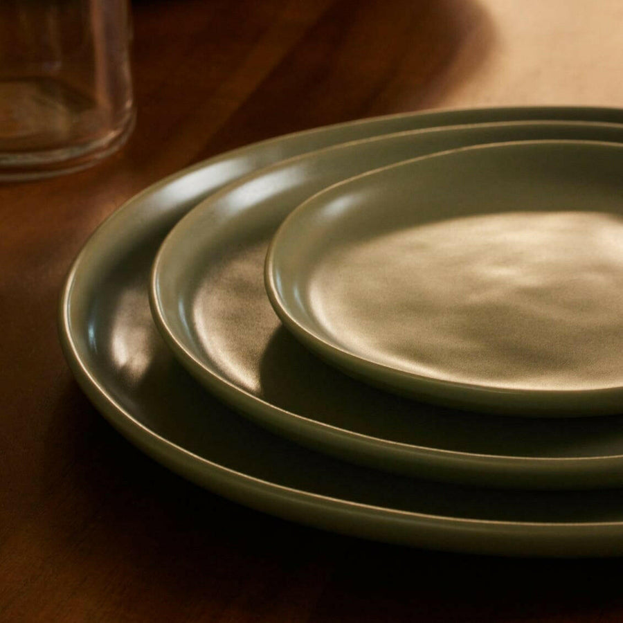 Elegant dessert plates set arranged on a dining table, showcasing refined style and sophistication