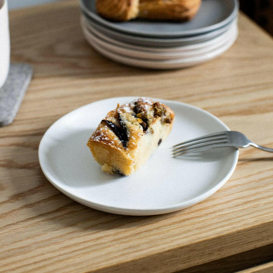 Elegant dessert plates set arranged on a dining table, showcasing refined style and sophistication