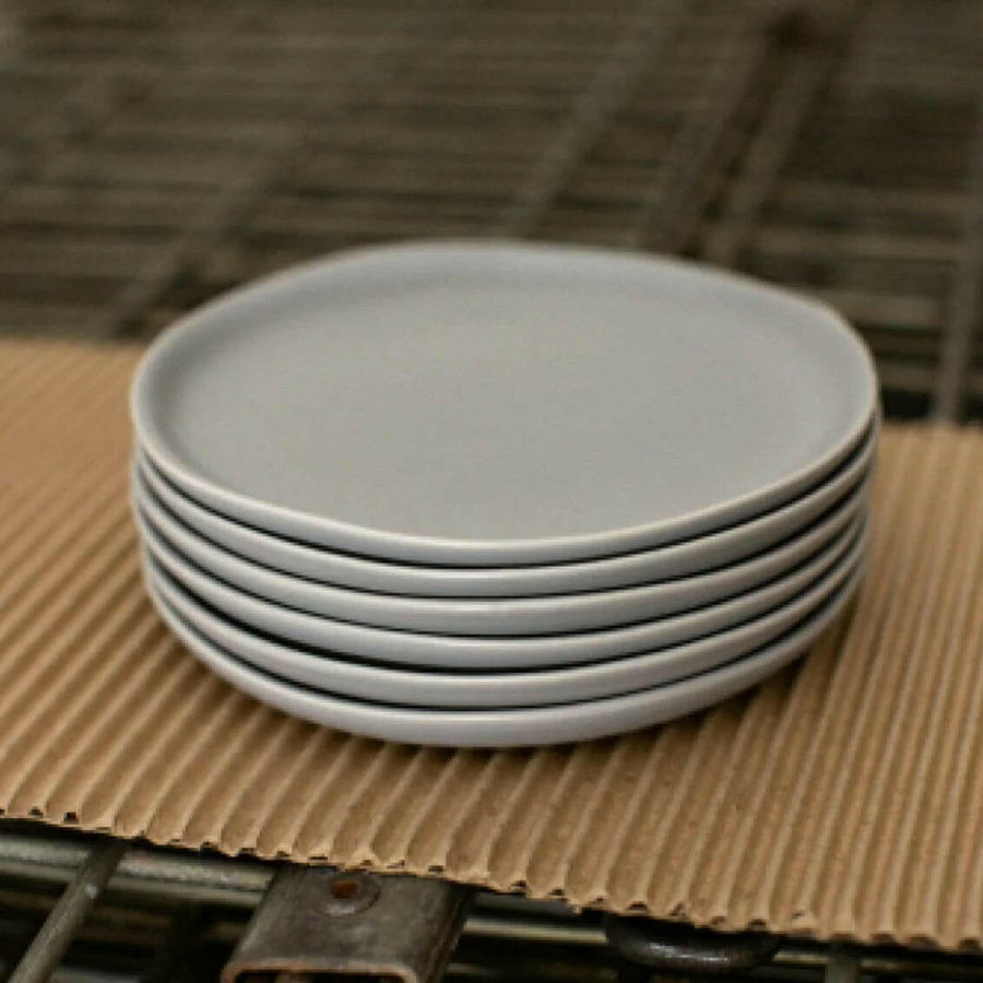 Elegant dessert plates set arranged on a dining table, showcasing refined style and sophistication