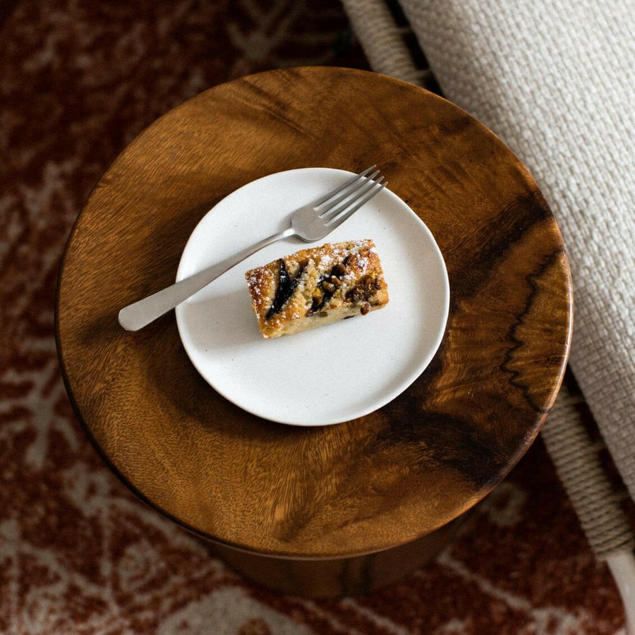 Elegant dessert plates set arranged on a dining table, showcasing refined style and sophistication