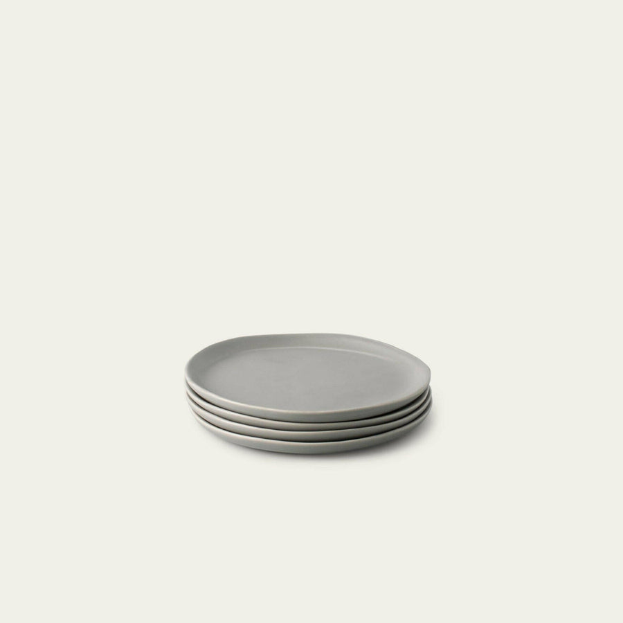 Elegant dessert plates set arranged on a dining table, showcasing refined style and sophistication