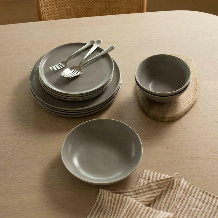 Elegant pasta bowls set on a dining table, showcasing refined craftsmanship and sophisticated design for upscale meals.