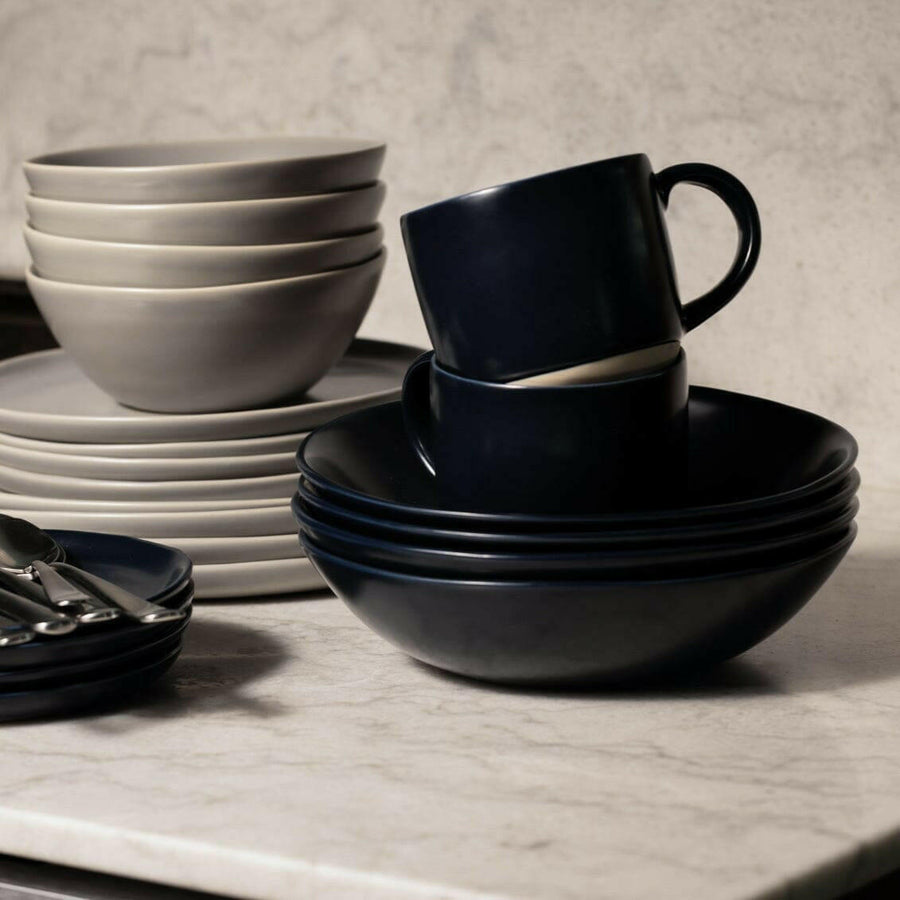 Elegant pasta bowls set on a dining table, showcasing refined craftsmanship and sophisticated design for upscale meals.