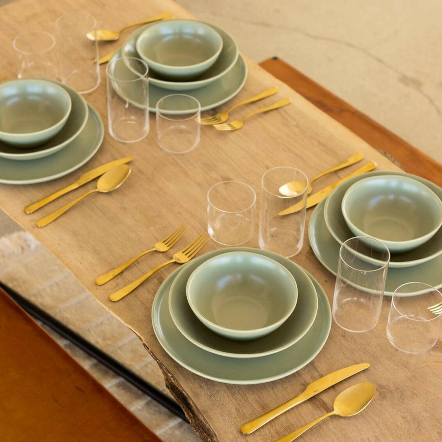 Elegant pasta bowls set on a dining table, showcasing refined craftsmanship and sophisticated design for upscale meals.