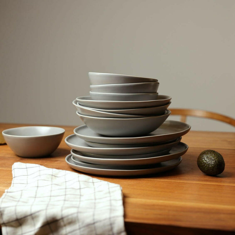 Elegant pasta bowls set on a dining table, showcasing refined craftsmanship and sophisticated design for upscale meals.